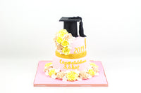 Two Tiered Yellow/Pink Graduation Cake - كيكة تخرج
