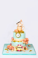 Two Tiered  Pastel Cake with cup on the top